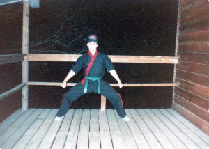 Michael Myrick as a green belt in karate, wearing a cap as a tribute to childhood friend Crystal